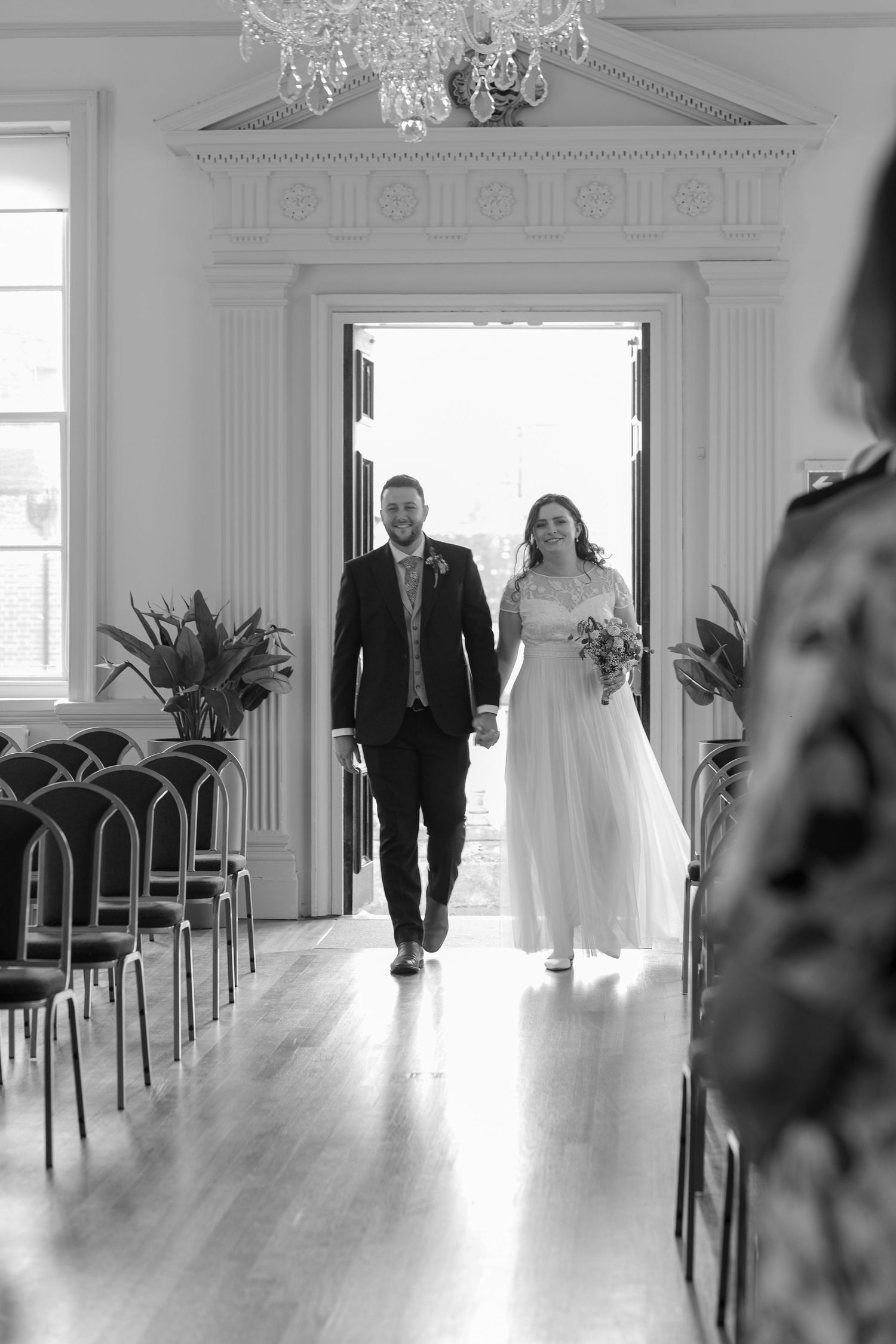 Bride and Groom walk down the aisle to start their wedding ceremony together