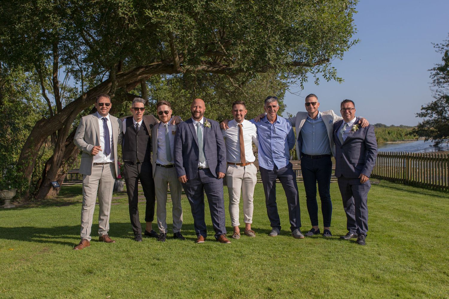Groom poses for a group photo with his best friends.