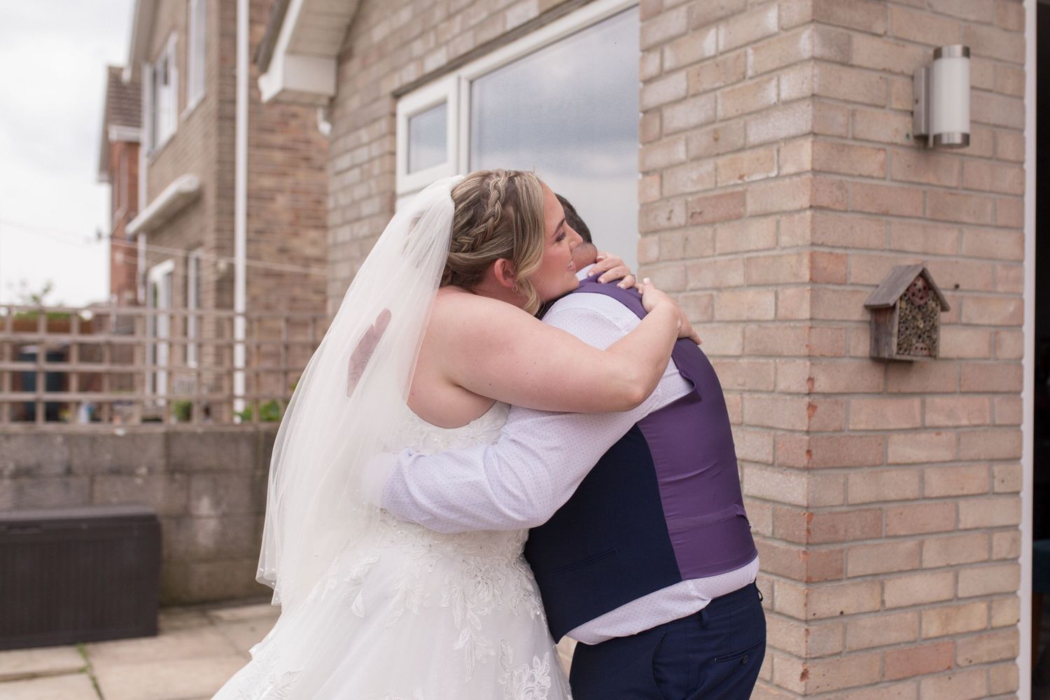 Bride and her father share a hug after an emotional first look