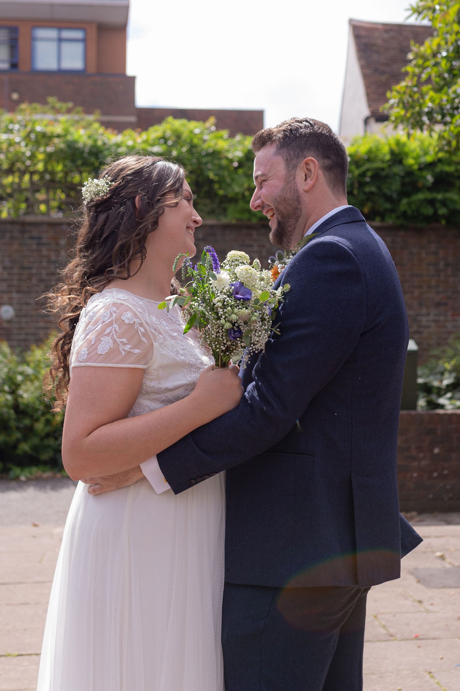 Bride and Groom stand together, in each others arms, during a intimate, private first look