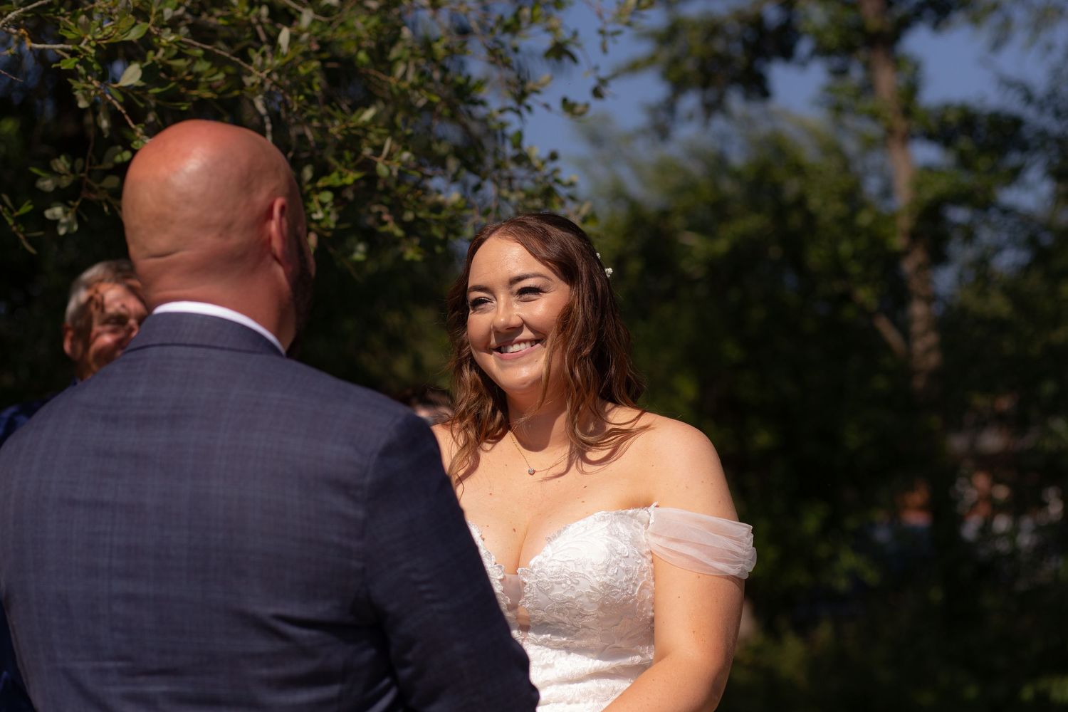 Bride looks at the groom as they share their wedding vows
