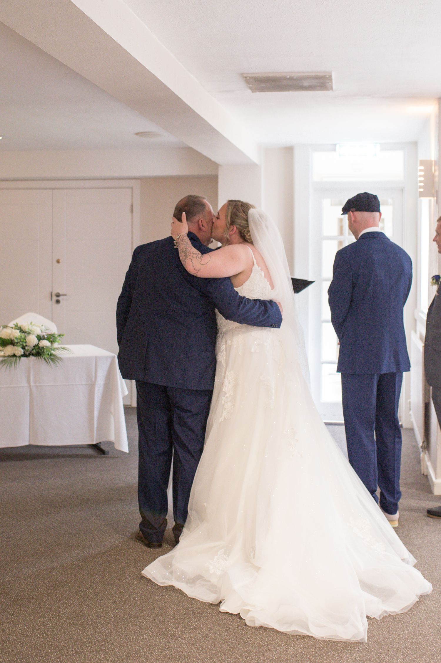 Bride and her father share one last hug at the front of aisle before the start of the wedding ceremony