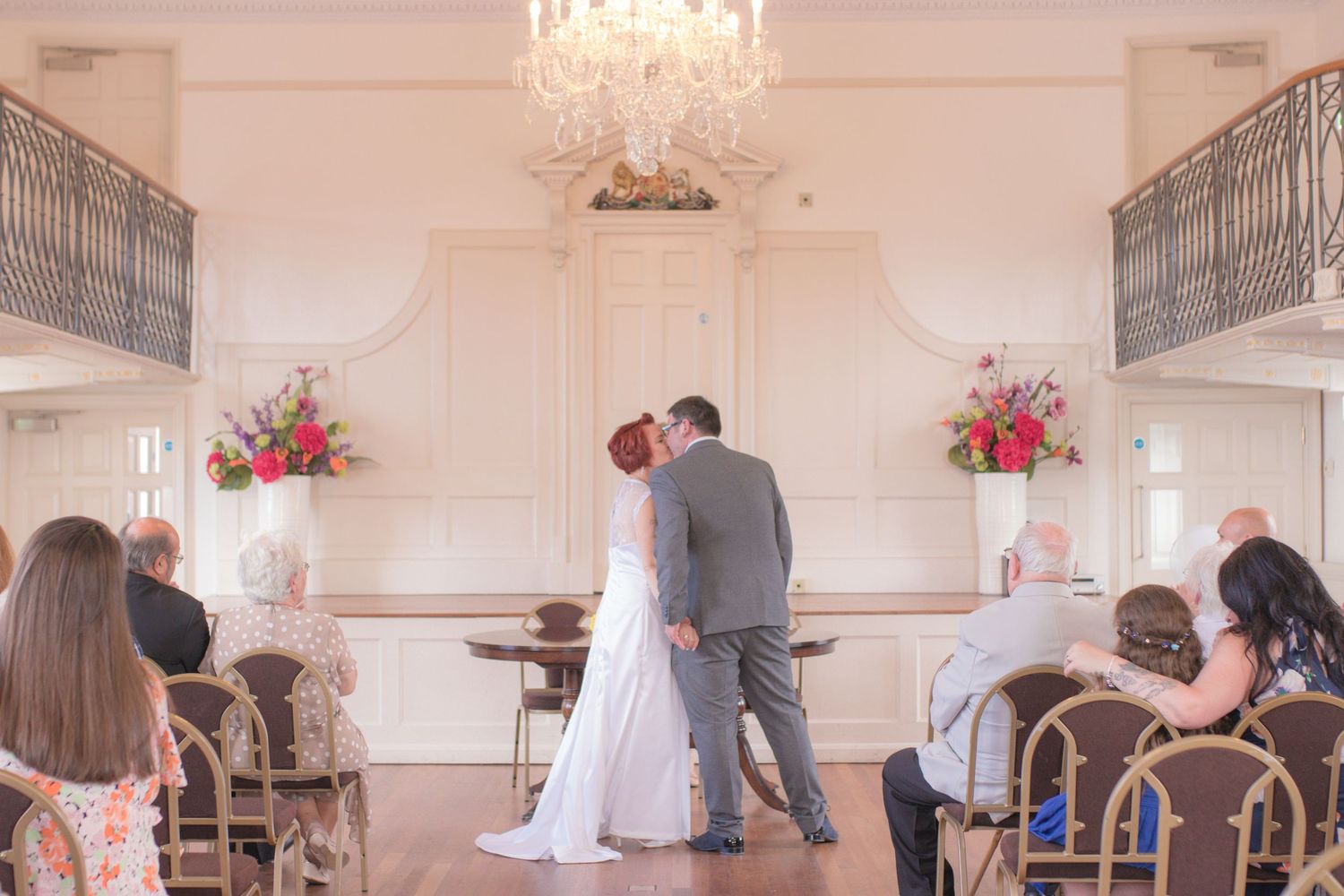 Bride and Groom share their first kiss during their ceremony at Poole Guildhall
