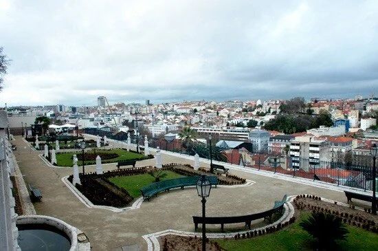 Series of panoramic views showing Lisbon's cityscape and waterfront from elevated viewpoints.