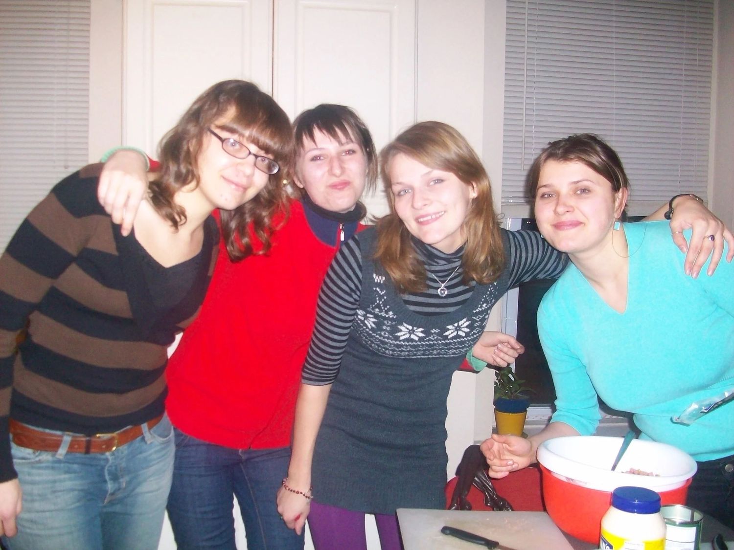 Group photo of friends gathered together at an indoor party.