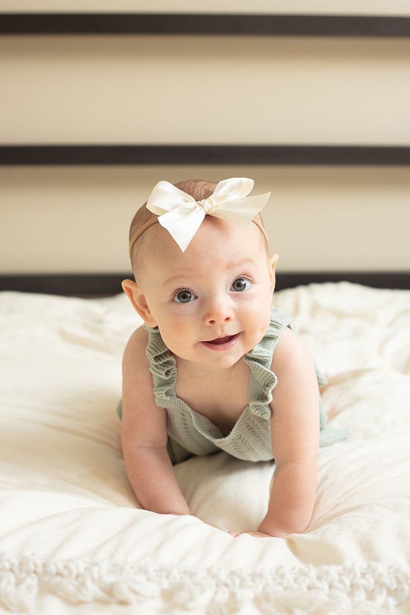 In-home lifestyle family session capturing a smily baby near Atlanta, Georgia