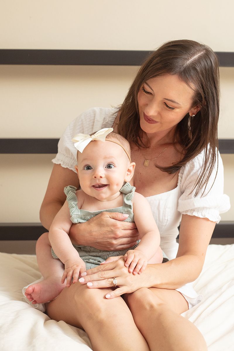 Douglasville family photographer capturing a mom and daughter moment in bedroom