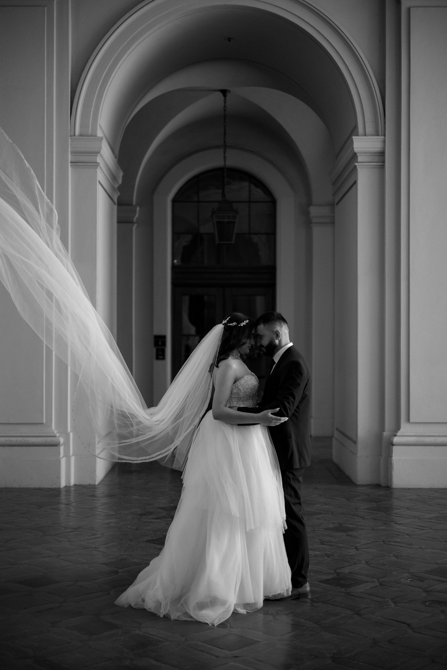 Romantic wedding kiss under California sunlight — timeless emotions preserved.