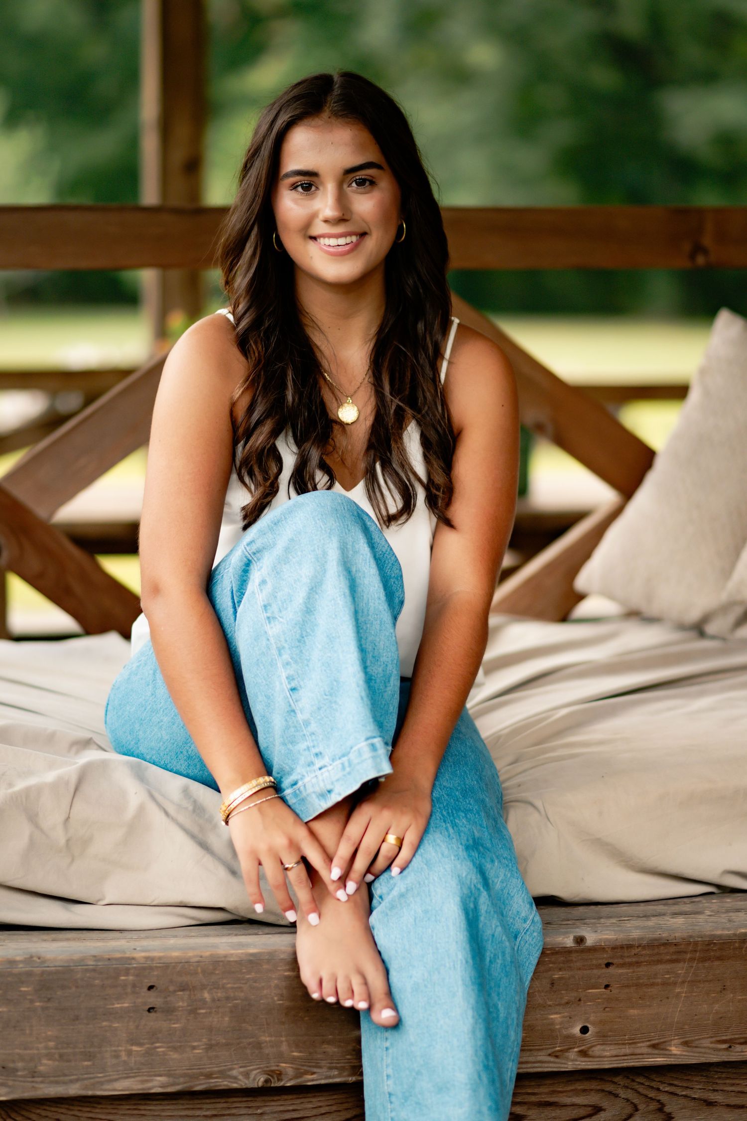 Relaxed outdoor portraits on wooden deck with light blue denim accents.