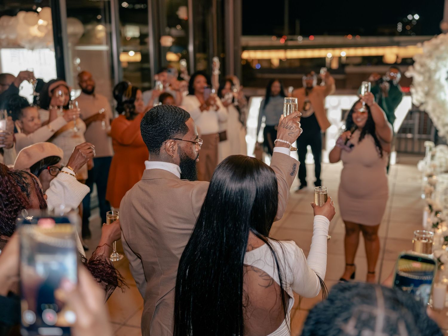 Couples dance together during a romantic ballroom dance lesson in an elegant indoor venue.