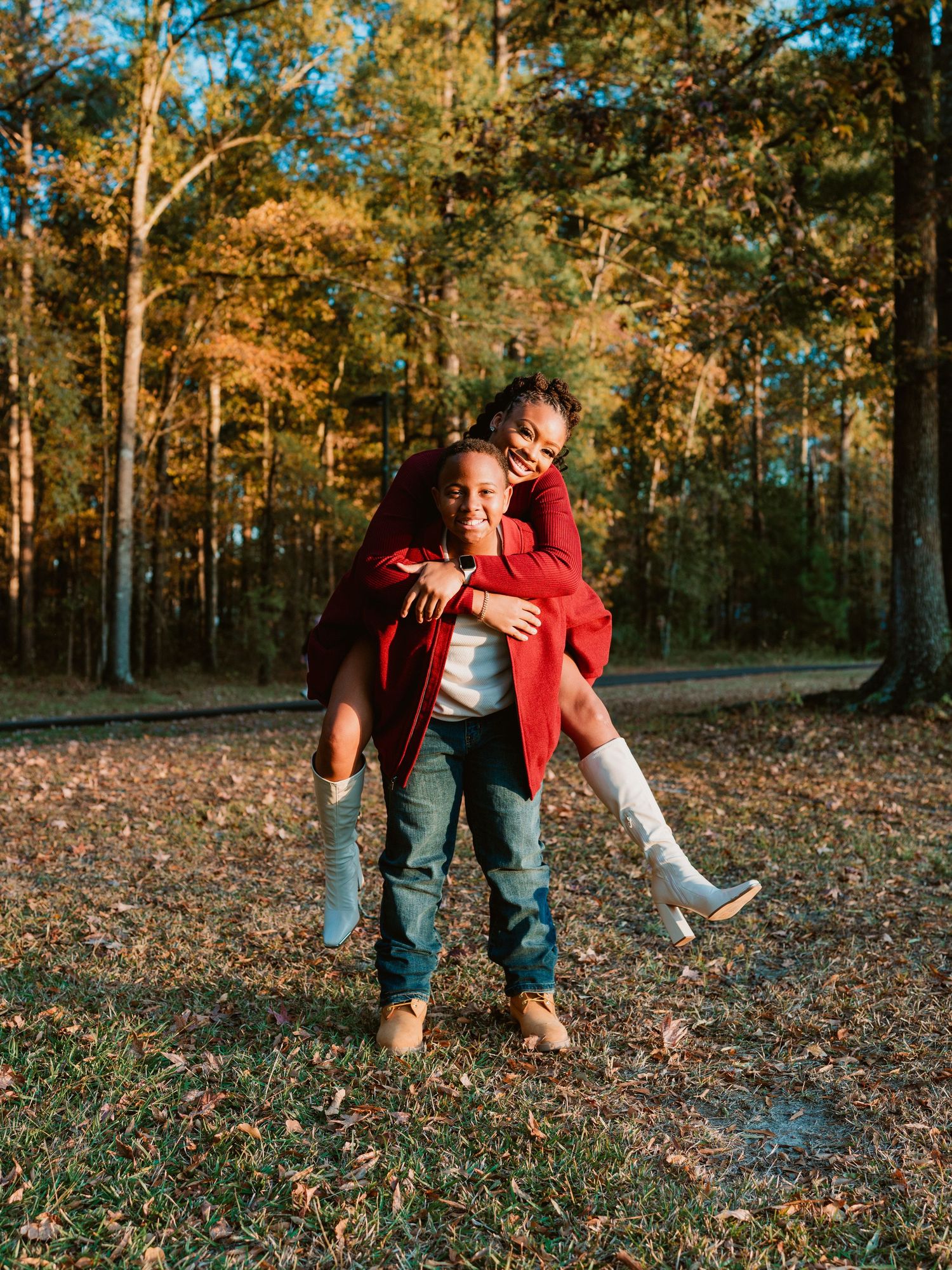A playful sequence of fall photos showing two people in casual wear playing and interacting on leaf-covered ground.