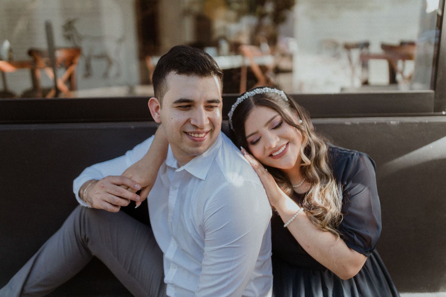 Sweet candid moment shared between couple during photo session.