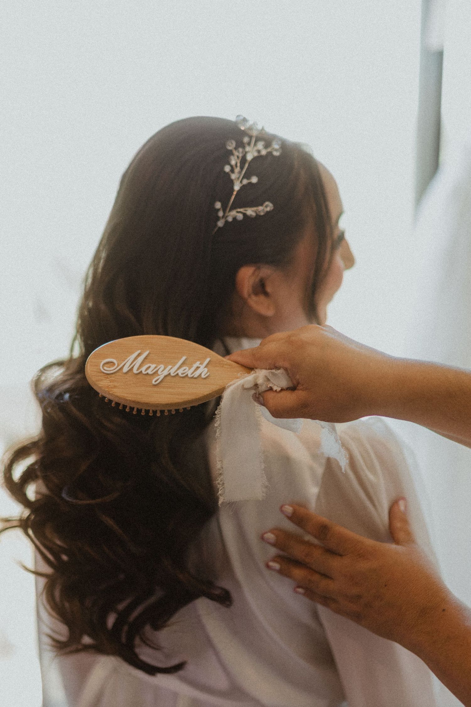Wedding preparation details showing hair accessories and styling moments.