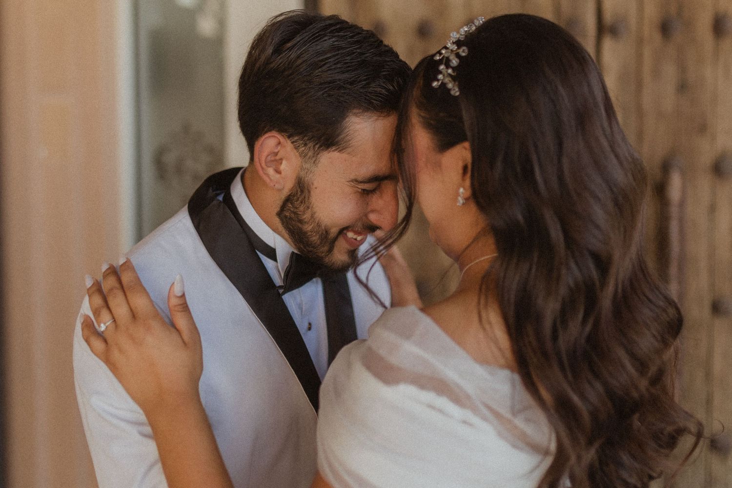 An intimate moment between newlyweds as they share a close embrace.