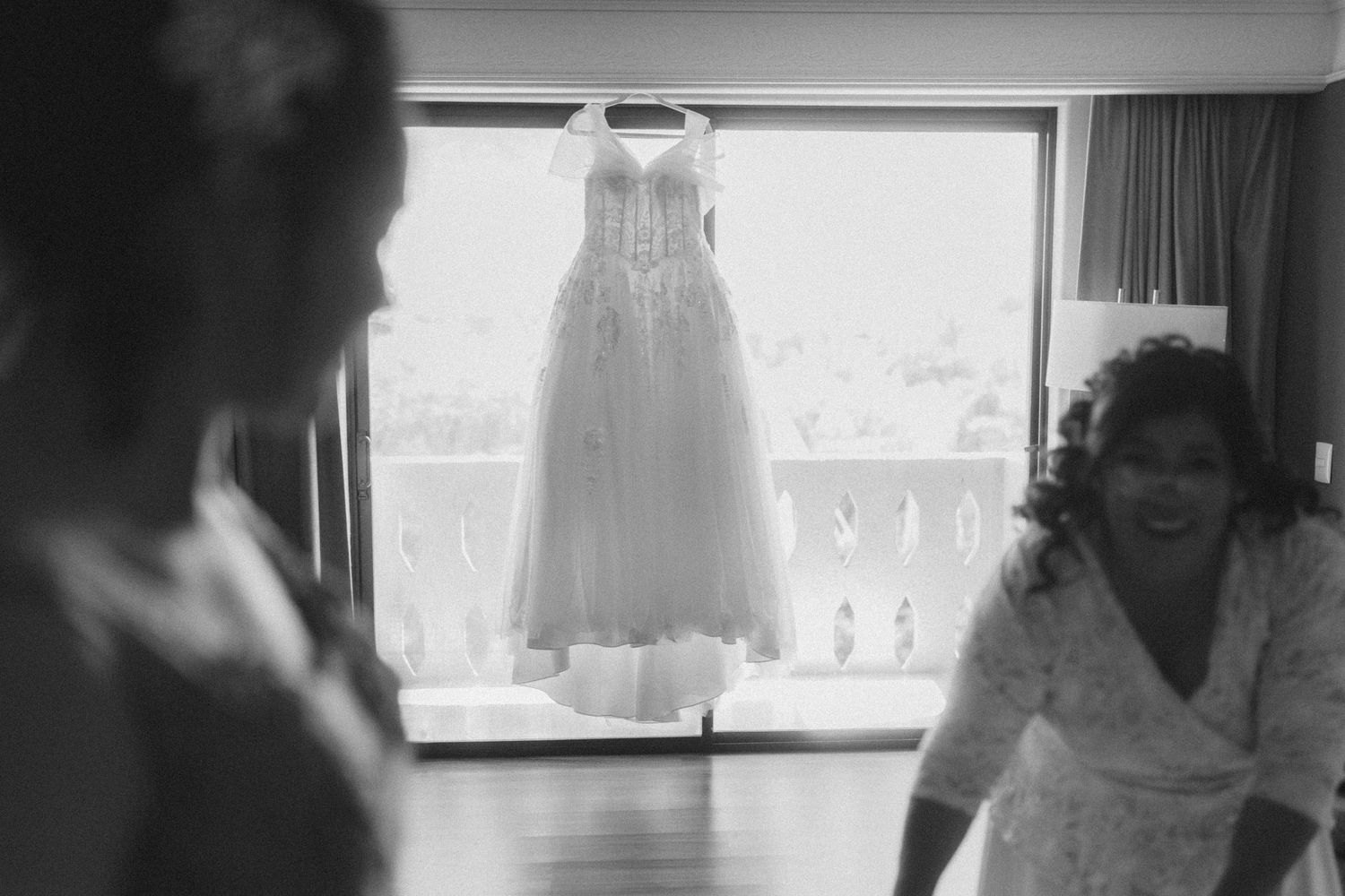 A series of black and white photos showing preparations in a bright room with windows.
