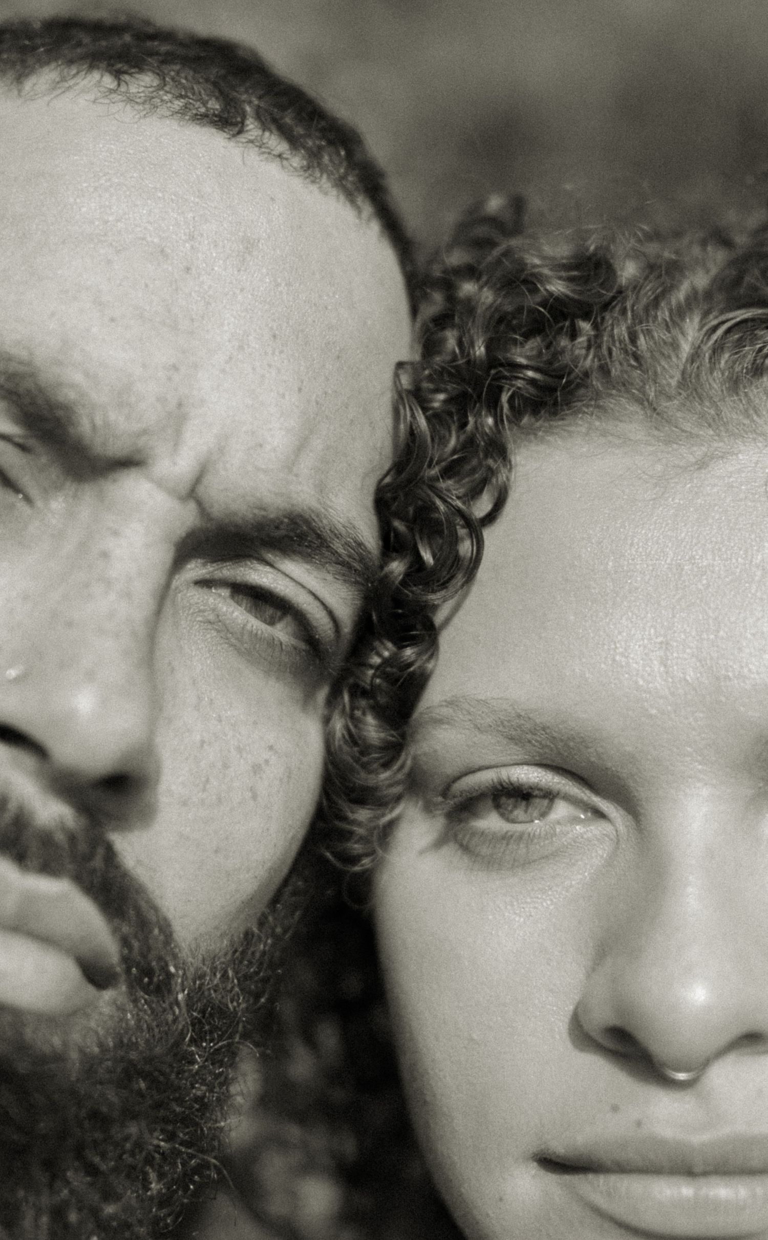 A black and white artistic portrait series showing close-up details of facial features in dramatic lighting.