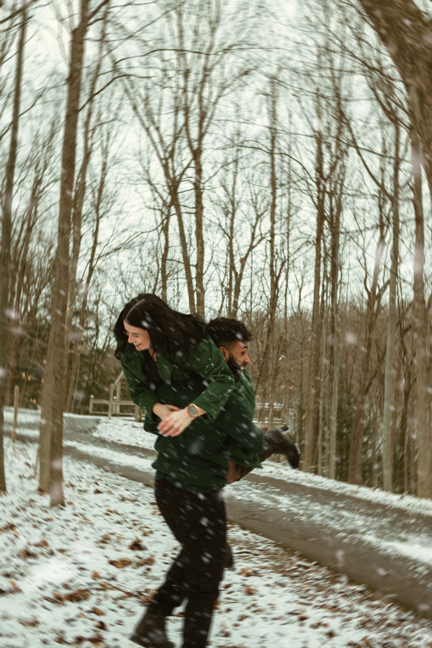 Four sequential photos show a person carrying a Christmas tree through a snowy forest path.