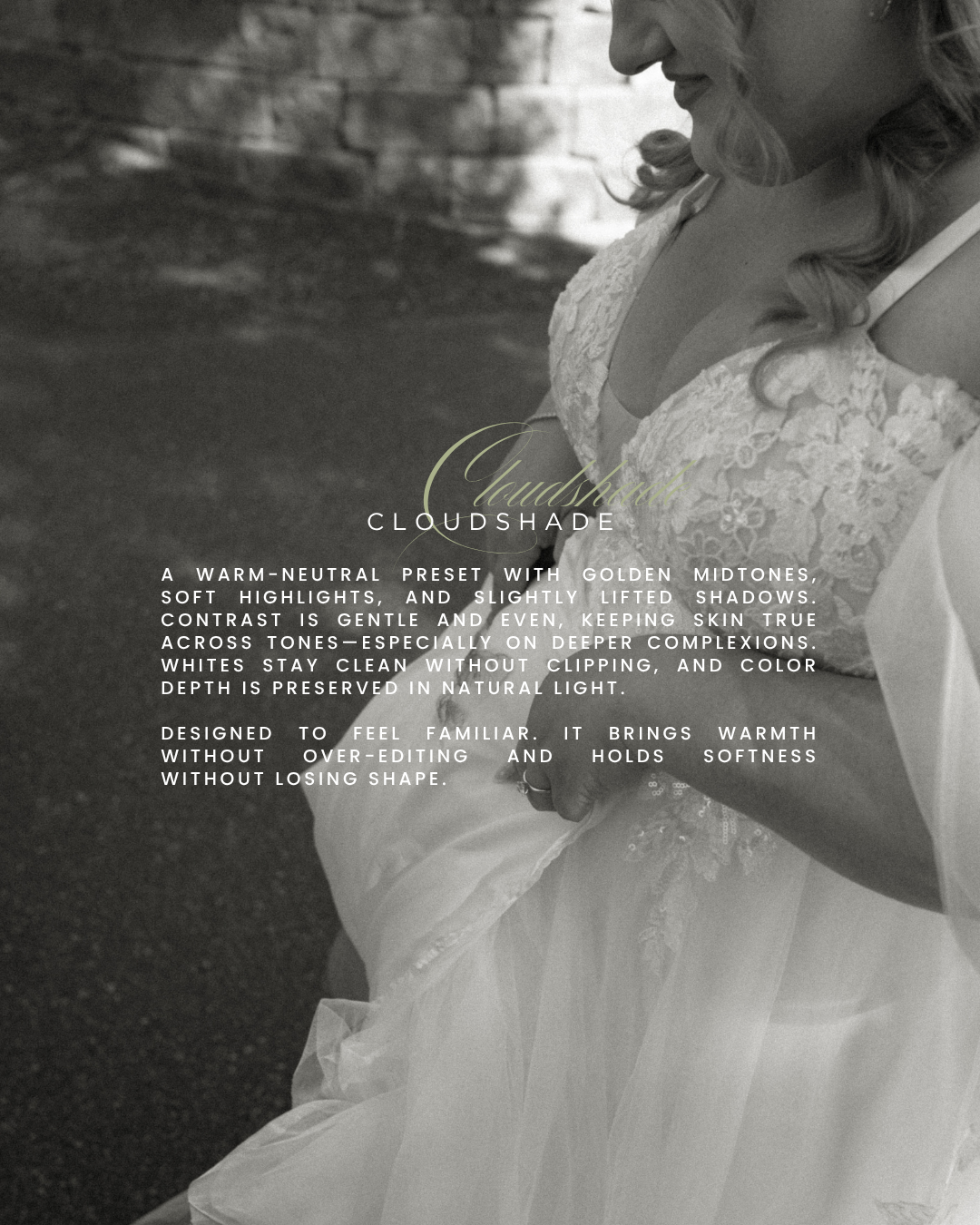 A close-up black and white wedding photo showing intricate lace details of a bridal gown against a textured background.