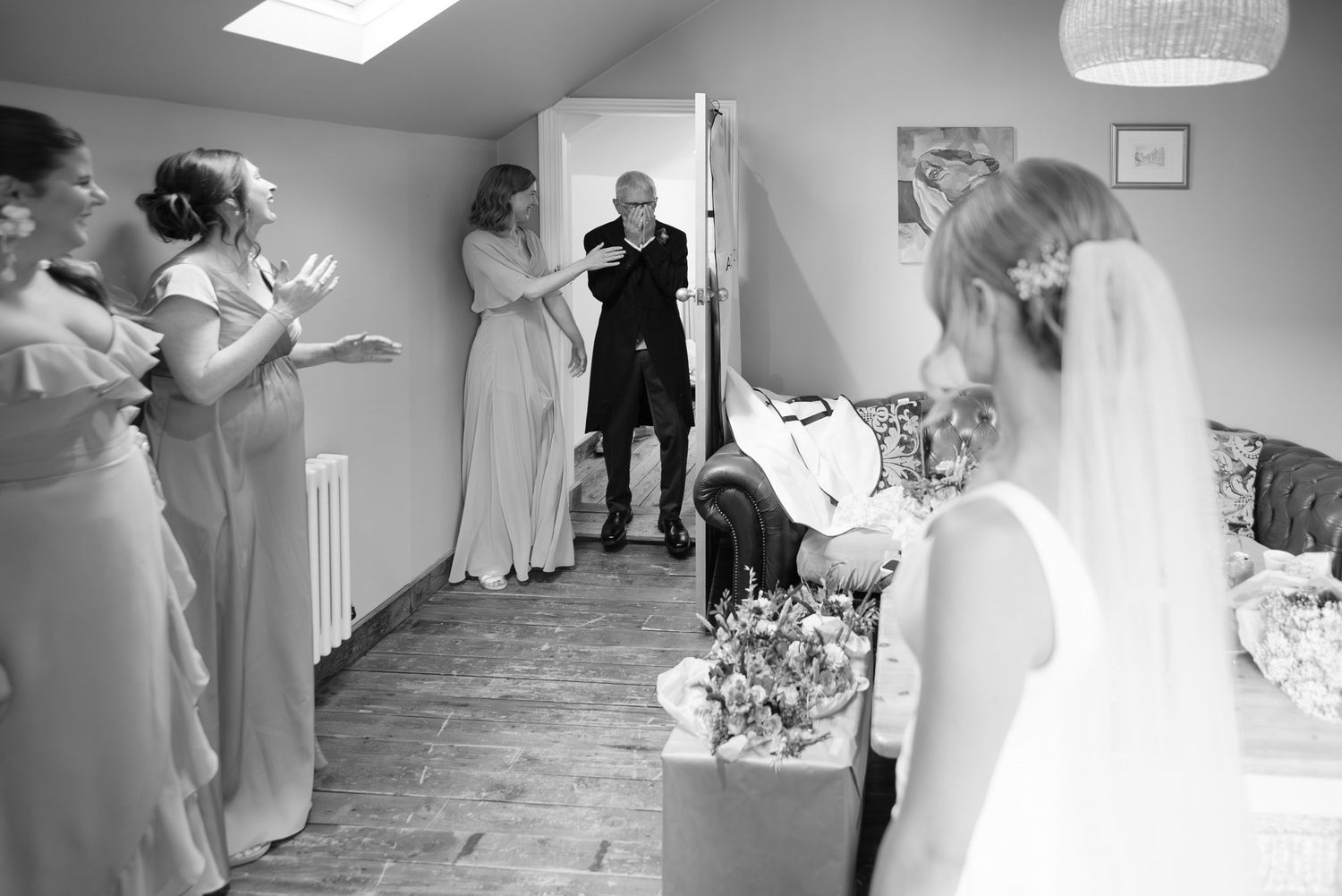 Wedding venue interior with natural light streaming through skylight.