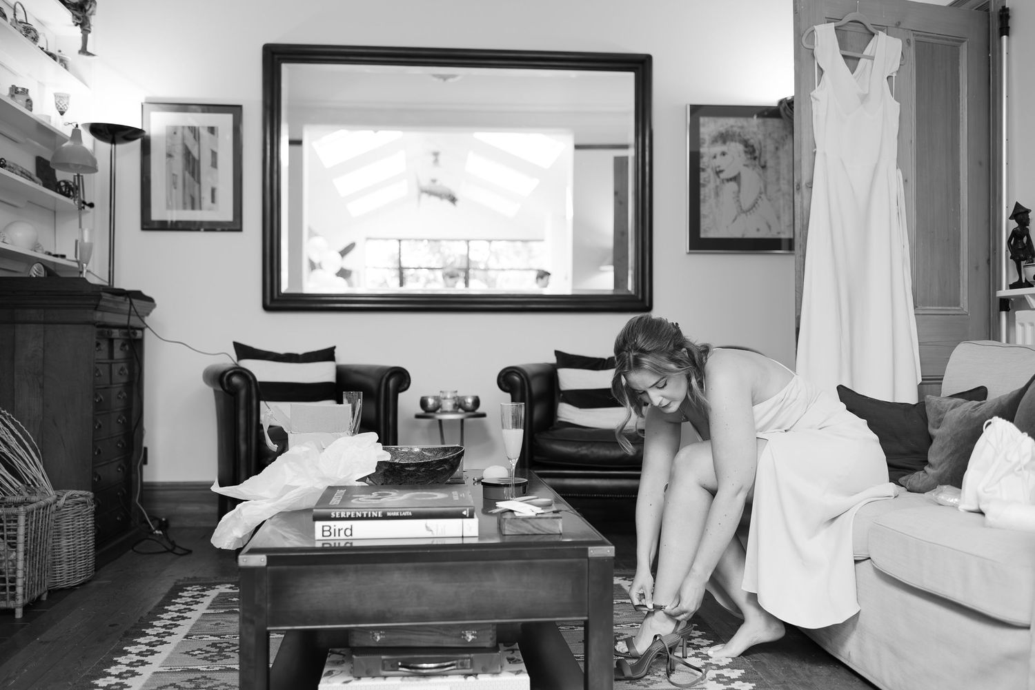 Series of black and white photos showing quiet moments in different interior rooms.