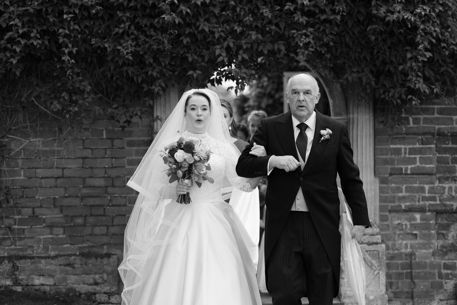 A black and white photo collage showing six different wedding moments with couples in traditional wedding attire.