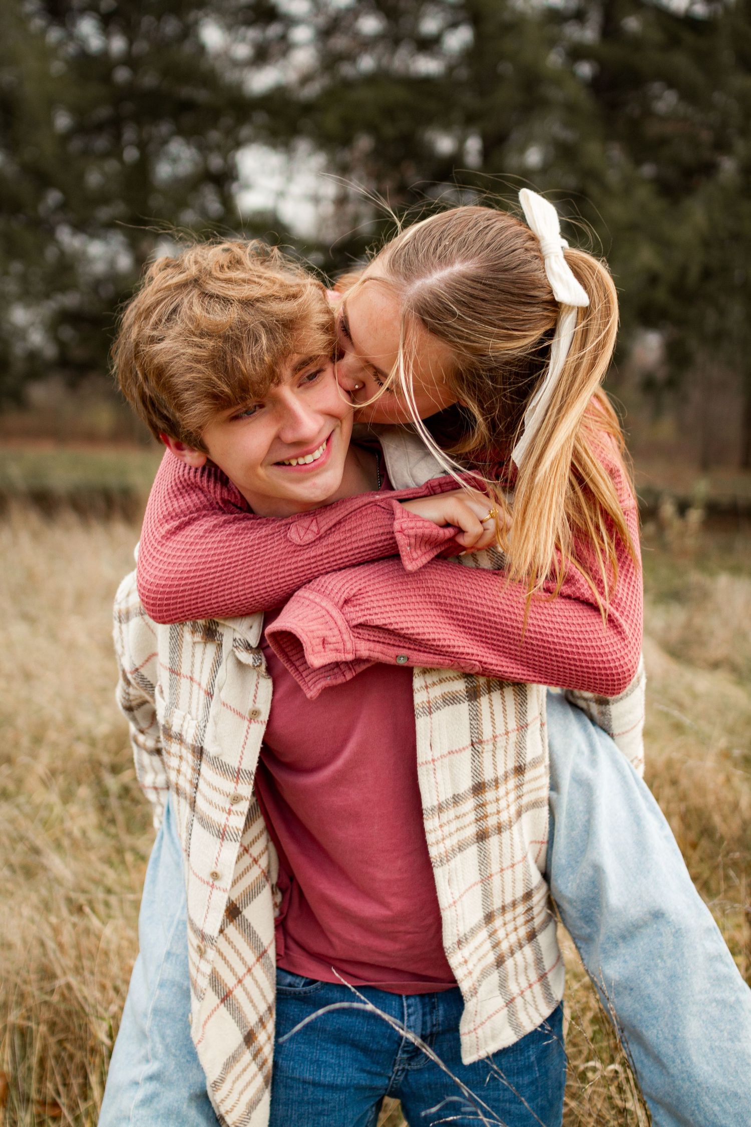 Couples photo in Allerton Park, capturing a couple's piggy-back ride. JDalbey Photography — couples portraits in Champaign IL.