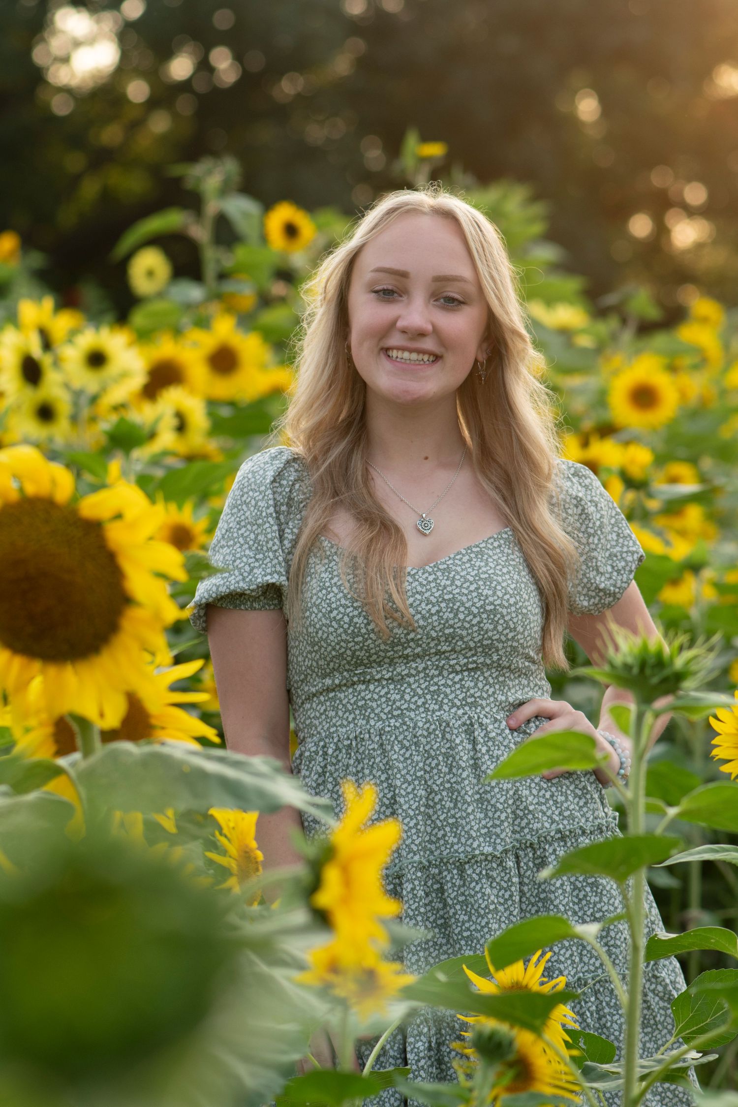 High school senior moment captured  in the sunflowers for a unique Simply Junique portrait session.