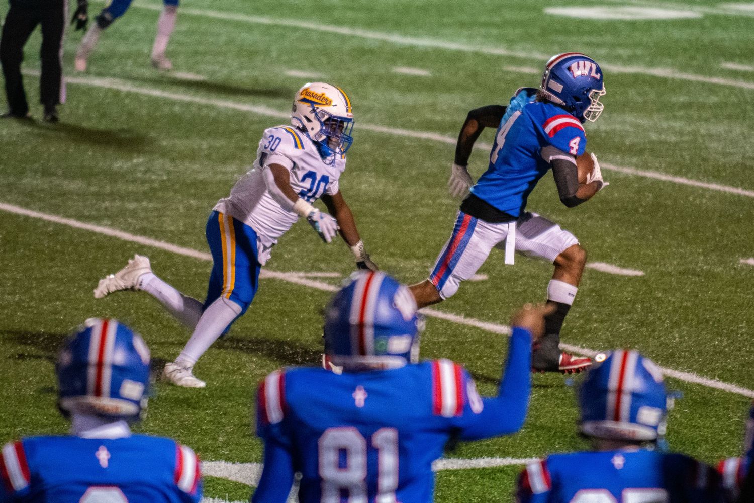 Florida Gators offensive and defensive lines line up against each other during a football play on the field.