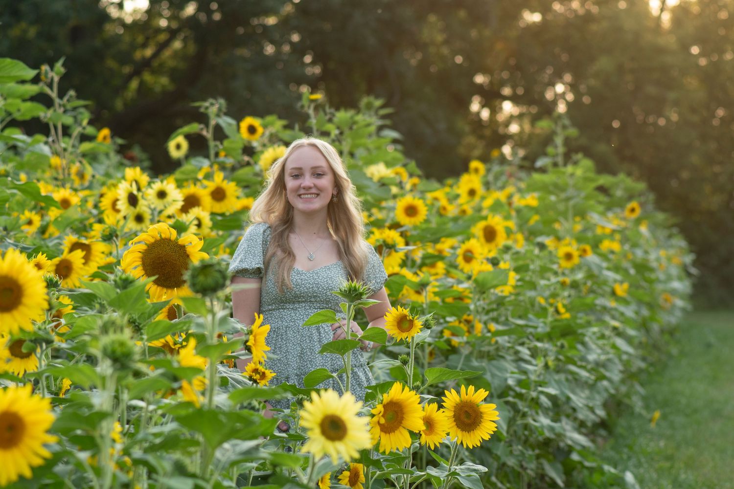 High school senior moment captured  in the sunflowers for a unique Simply Junique portrait session.