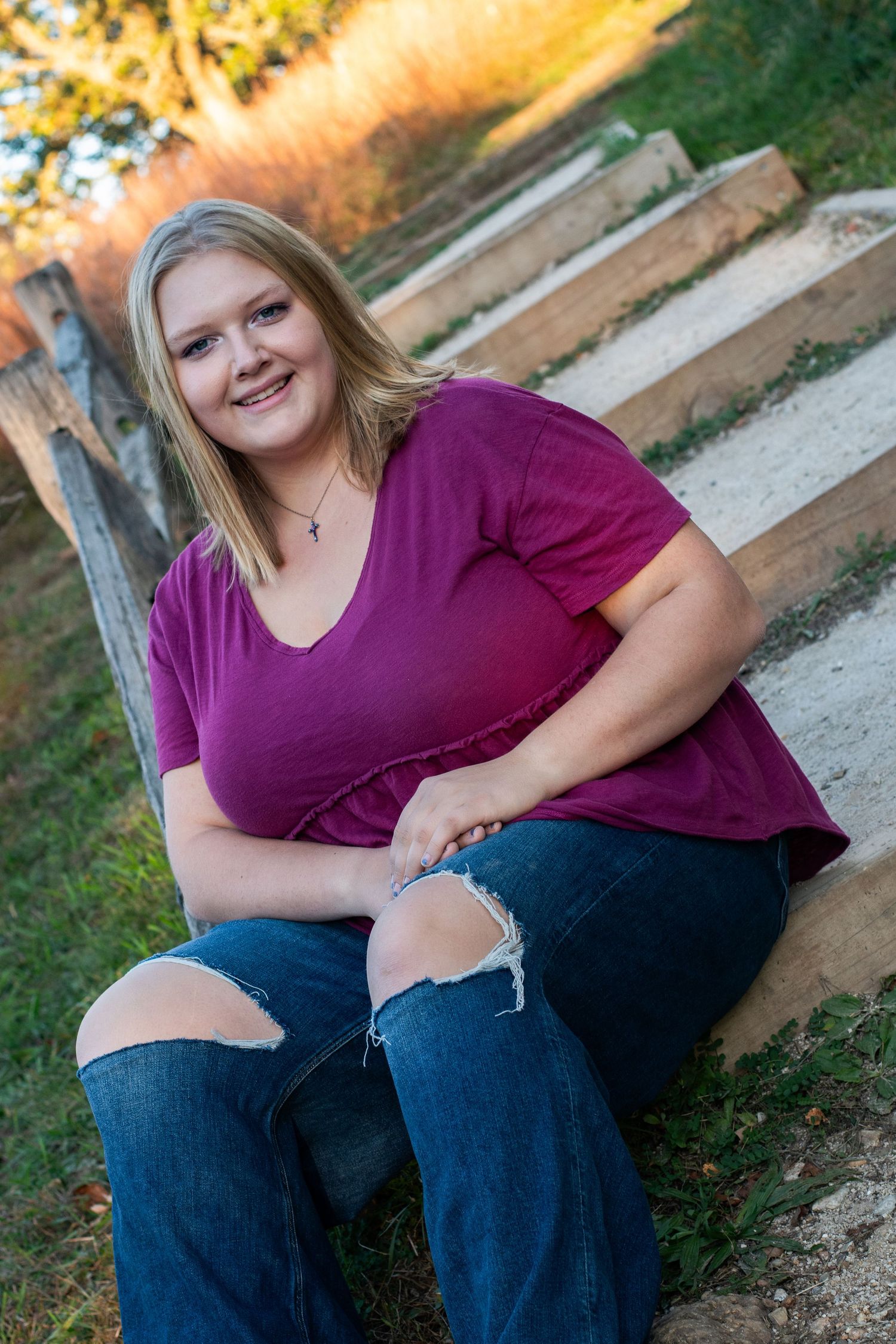 Portrait series showing casual outdoor poses in purple top and ripped jeans on wooden steps.