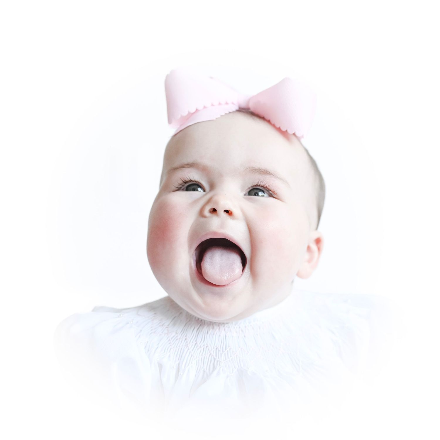 Close up portraits of baby with pink bow showing various adorable expressions.