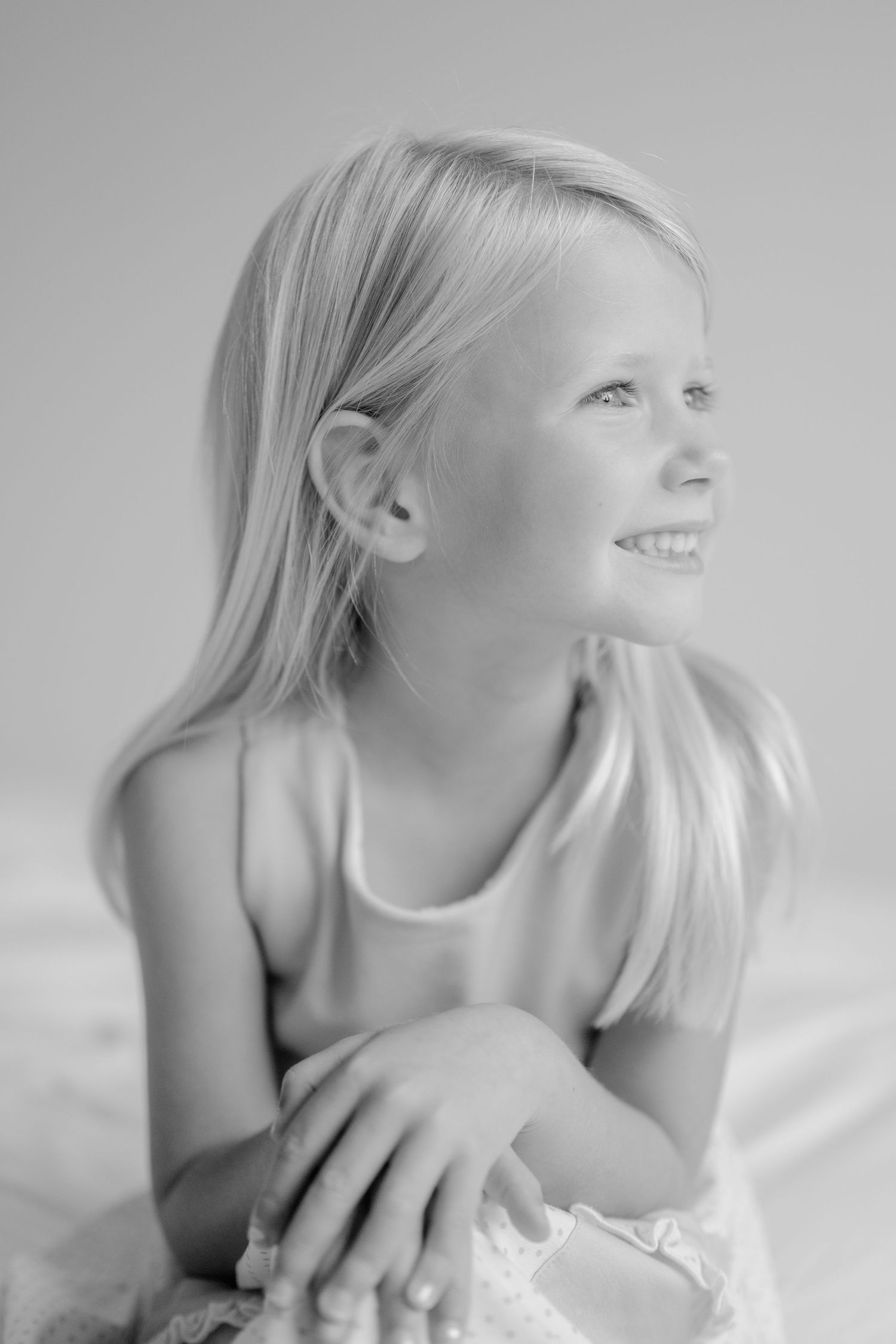 Artistic black and white portraits showing natural expressions and movement.