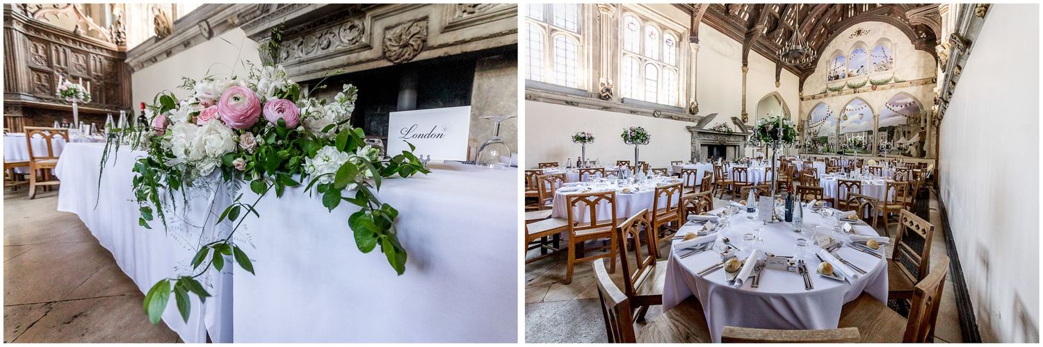 Wedding reception hall set with round tables and floral centerpieces under vaulted wooden ceiling.