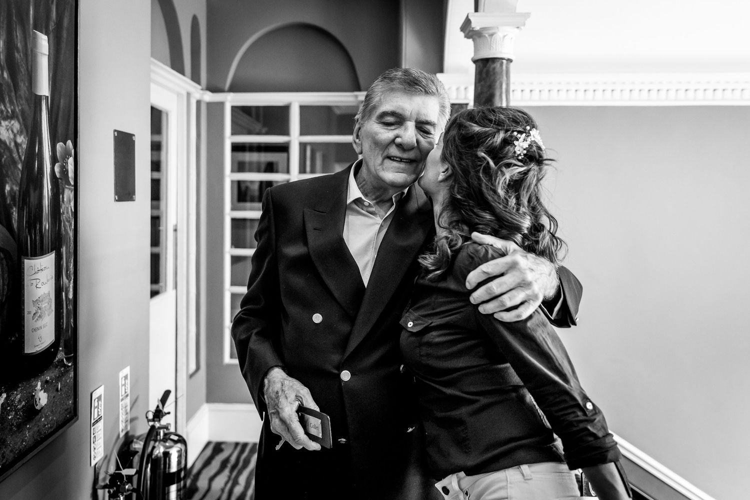 Black and white candid moments captured during a wedding celebration.