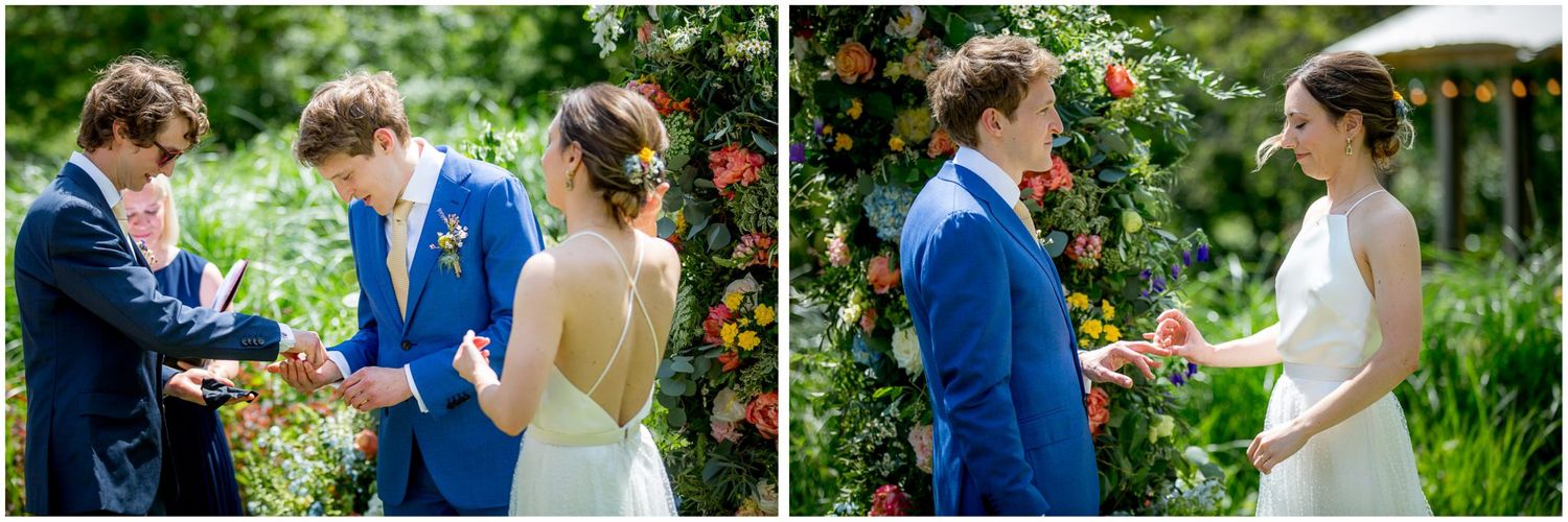Romantic first look between couple in garden setting with vibrant summer flowers.