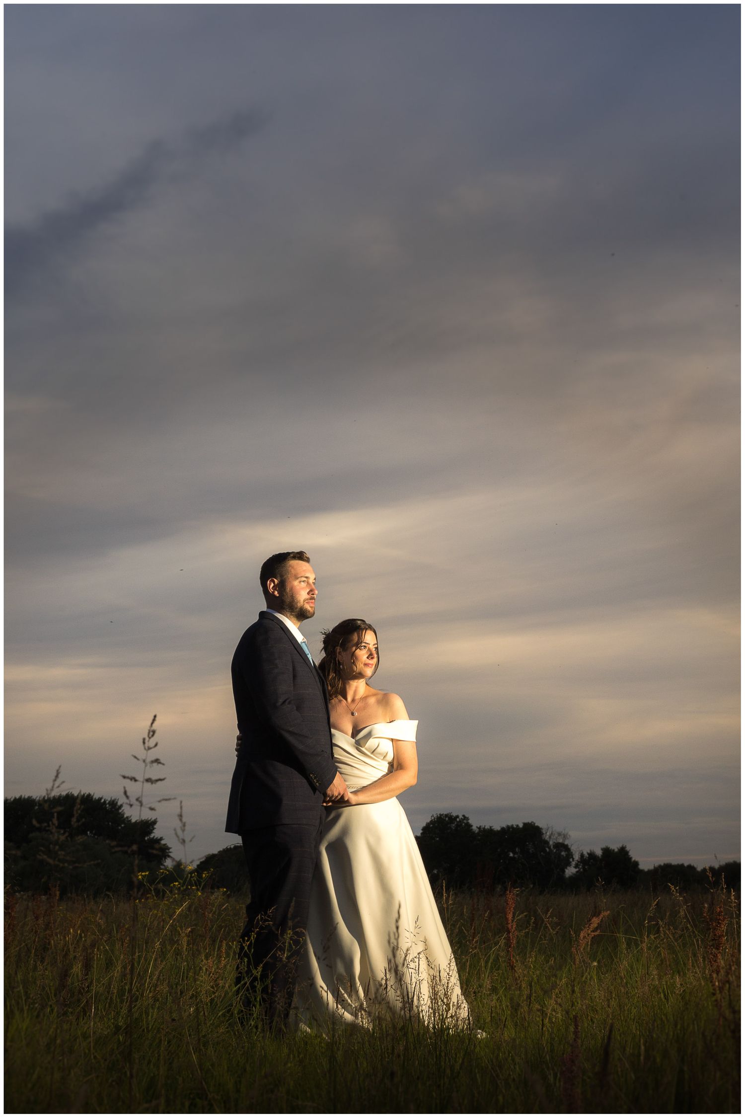 Bride and groom couple portrait photograph captured with flash in the water meadows at Sopley Mill in Hampshire