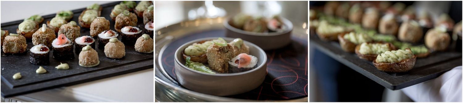 Artistic food photography showing elegant appetizers and hors d'oeuvres on dark plates.
