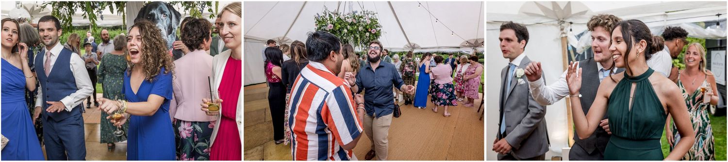 Wedding party members gather outdoors under a white tent during summer celebration.