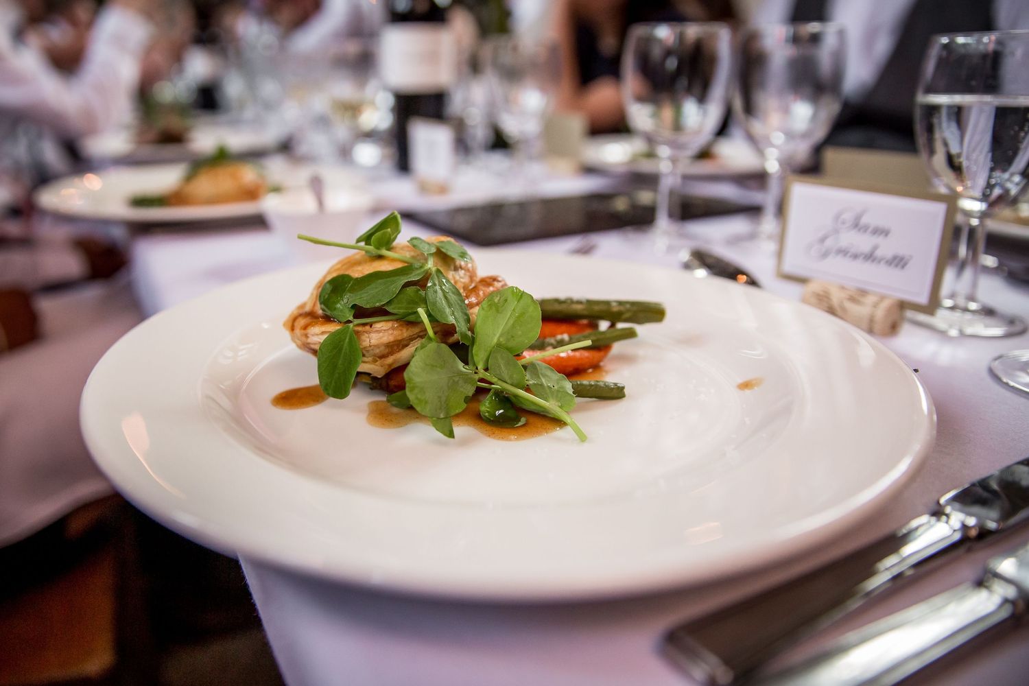 Beautifully plated gourmet dishes served at an upscale wedding reception.