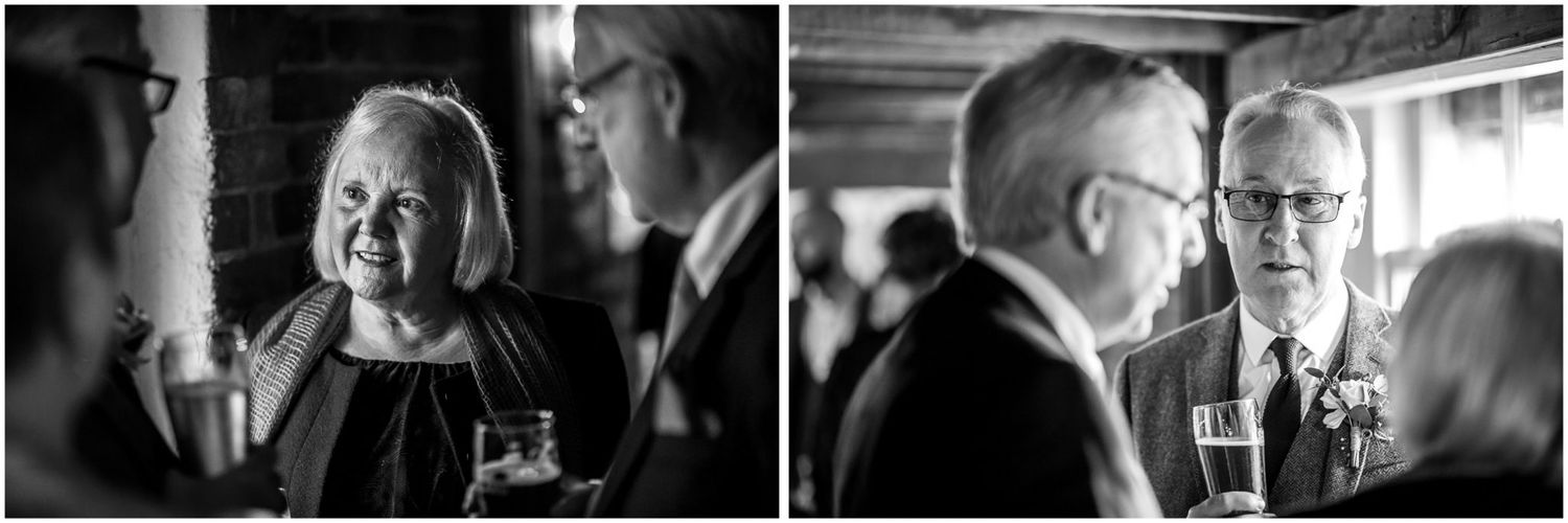 Wedding guests enjoying a lively celebration in a rustic indoor venue.