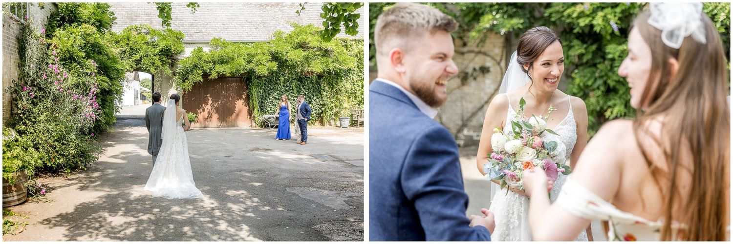 Outdoor garden wedding celebration with guests mingling on sunny summer day.