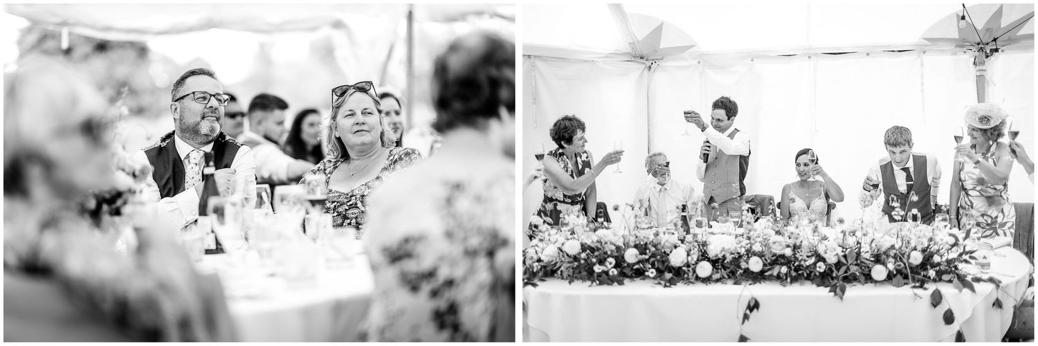 Artistic wedding photography showing natural interactions between guests at an outdoor venue.