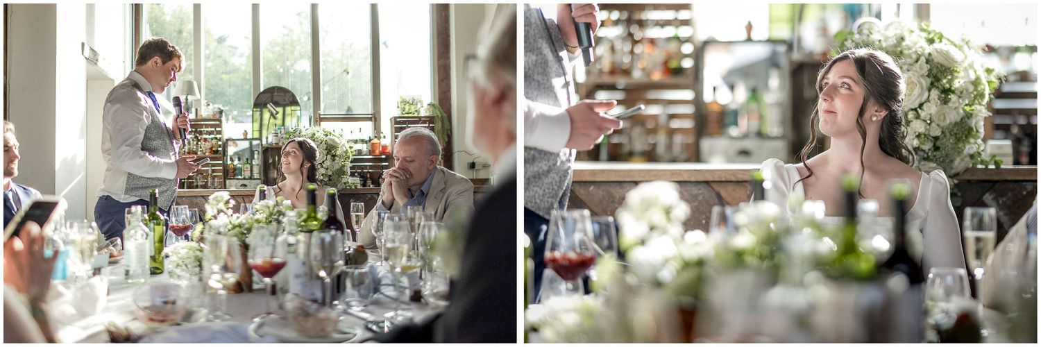 Natural light fills an elegant wedding reception venue decorated with floral arrangements.
