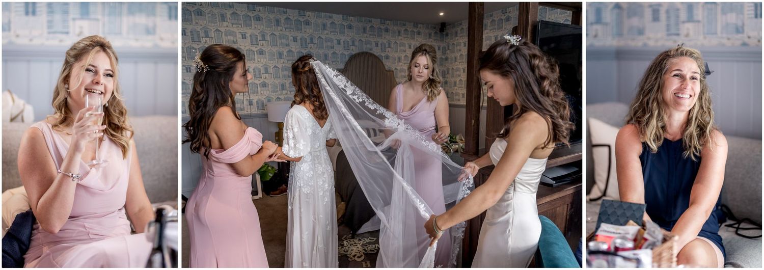 Bridesmaids in pink dresses helping with wedding preparations.
