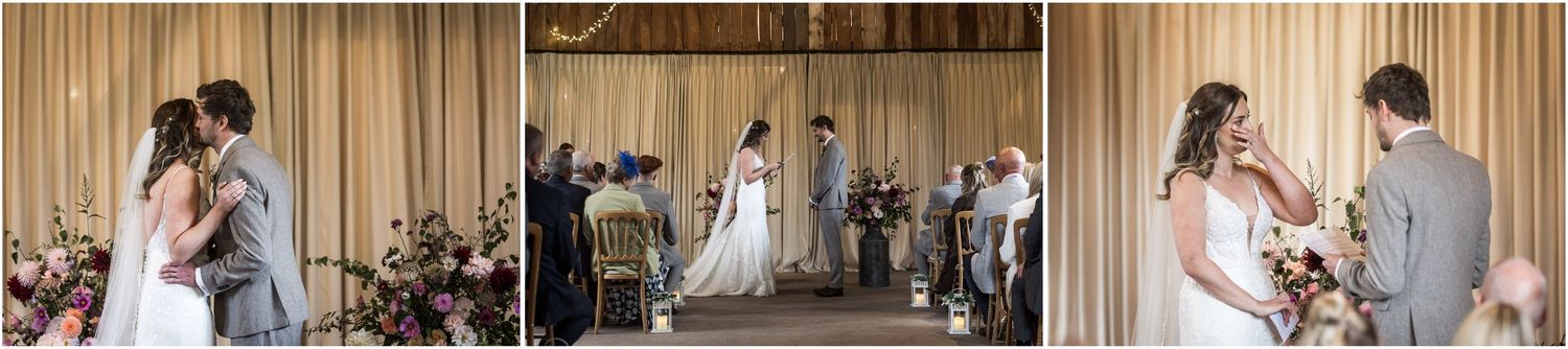 The bride and groom kiss during the marriage ceremony