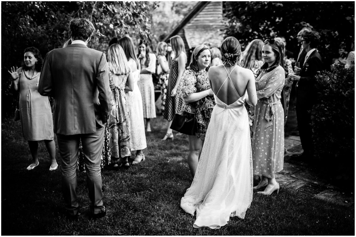 Black and white photos capture candid wedding reception moments.