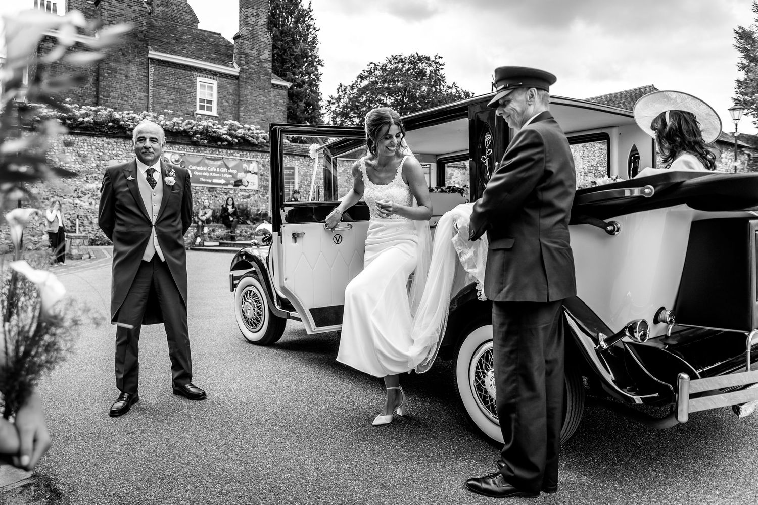 Black and white photos of vintage cars at a formal event.