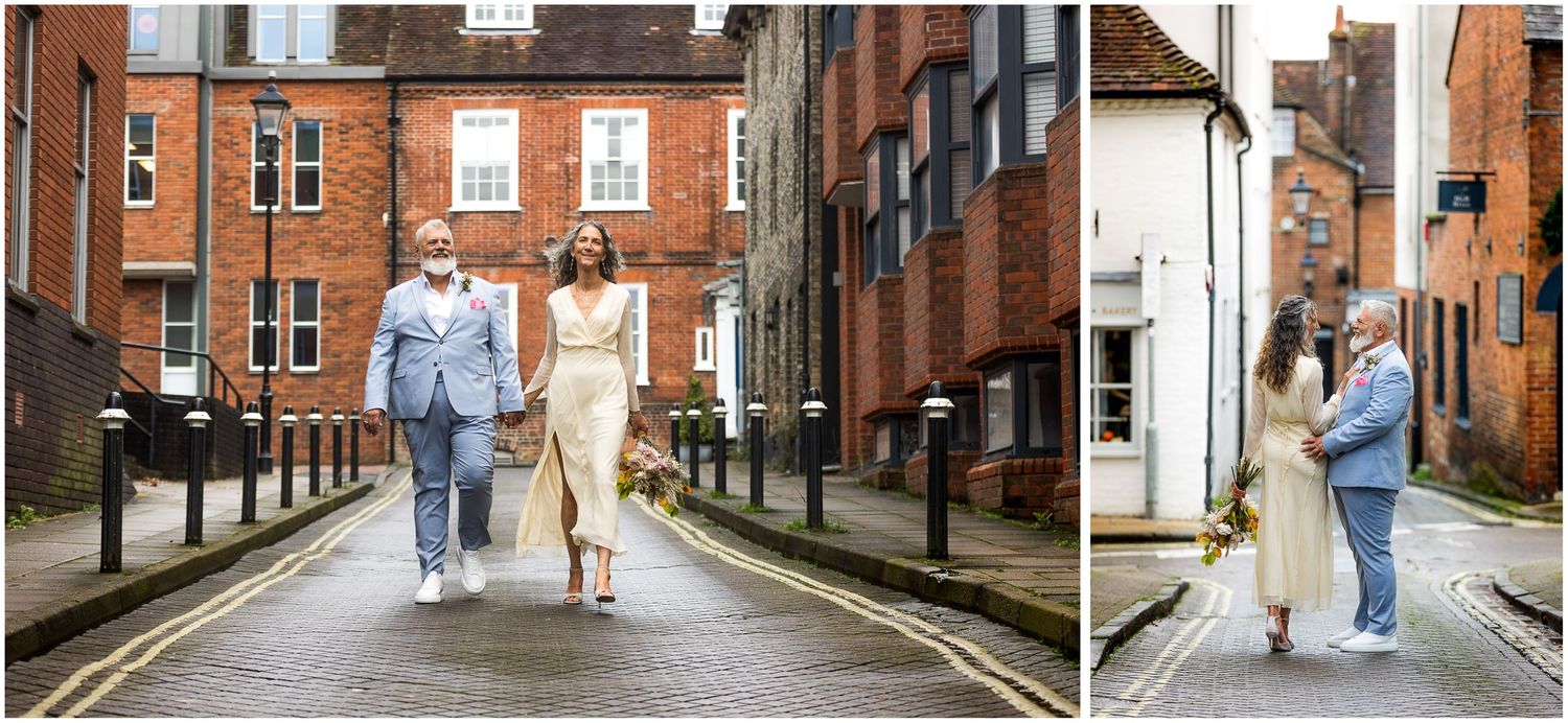 Bride and groom walk down Winchester's quiet back roads towards their wedding reception venue