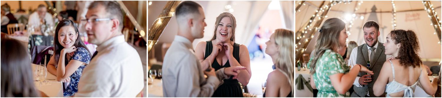 Wedding guests gather under string lights at an outdoor celebration.