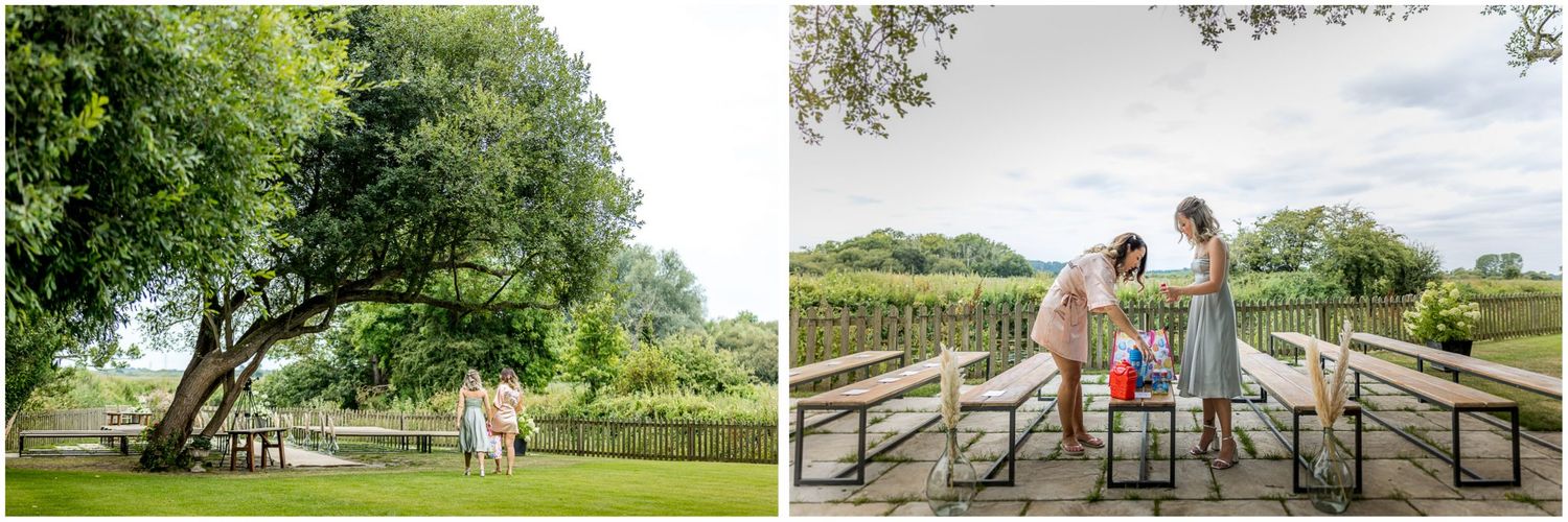 Rustic outdoor wedding venue featuring wooden fences and natural landscaping.